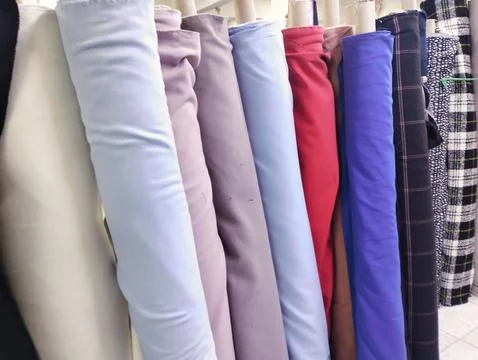 Stack of Fabric Rolls in market Stock Photos