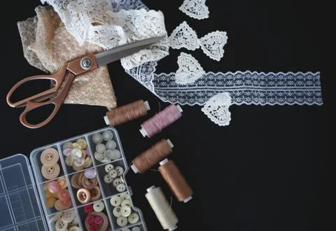 A stack of fabrics and sewing accessories on a tailor's table Stock Photos