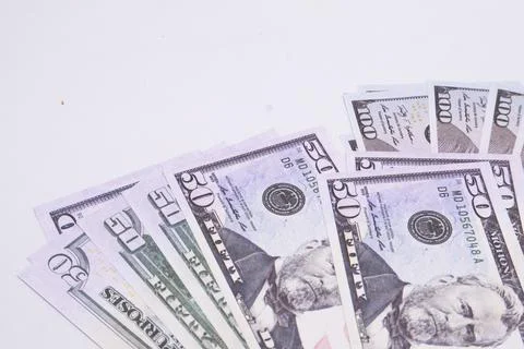 Stack of Fifty and One Hundred Dollar Bills on White Background, Financial .. Stock Photos