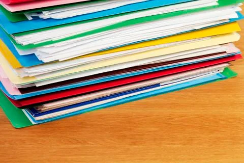 Stack of files on wood surface horizontal 스톡 사진