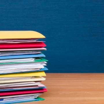 Stack of files on wood surface square Stock Photos
