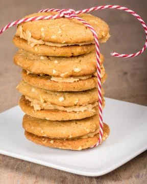 Stack of filled cookies tied with string Stock Photos
