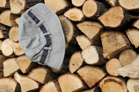 Stack of firewood and hat Stock Photos