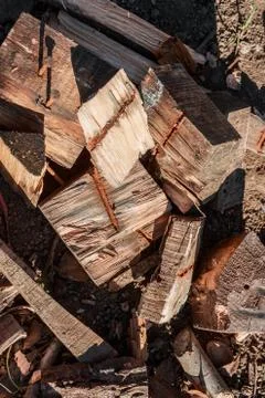 Stack of firewood, background stacks of wood. Dry chopped firewood, ready for Stock Photos