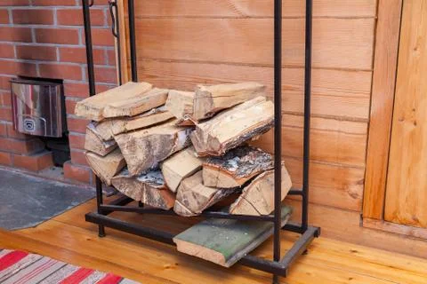 A stack of firewood from a birch tree for igniting a fire in the bath Stock Photos