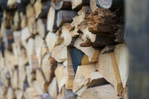 Stack of firewood on blurry background Stock Photos