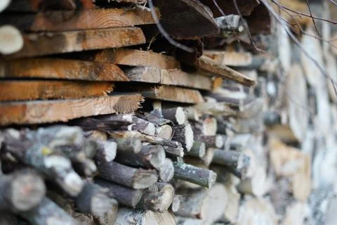Stack of firewood on blurry background Stock Photos