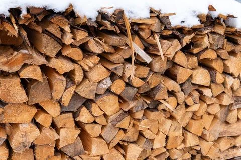 Stack of Firewood Close Up (Timber) with Snow Stock Photos