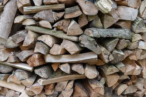 Stack of Firewood Logs for Burning in Rustic Outdoor Storage Area Stock Photos