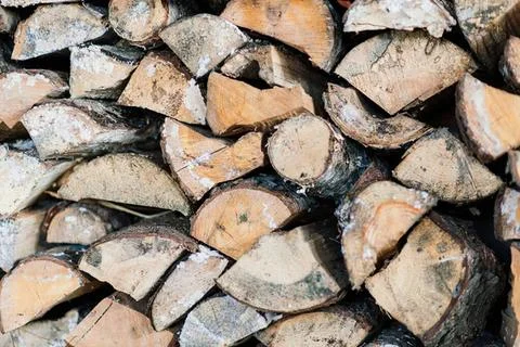 Stack of firewood logs in a pile for burning or decoration Stock Photos