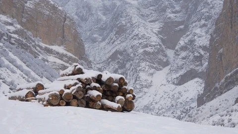 Stack of firewood in the mountains in the snow Stock-Footage 85727731
