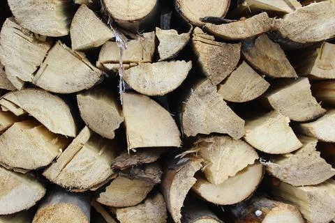 Stack of firewood snow covered in winter Stock Photos