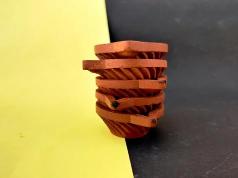 A stack of five Clay lamps or diya or oil lamps one over other. Indian type.I Stock Photos