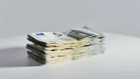 Stack of Five Euro Banknotes Rotating on Platform Symbolizing Personal Finance Stock Footage 336666576
