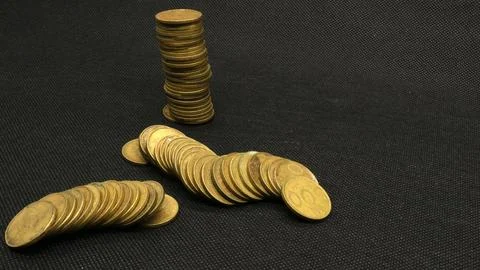 Stack of five hundred rupiah yellow Indonesian coins Stock Photos