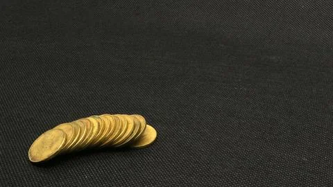 Stack of five hundred rupiah yellow Indonesian coins Stock Photos