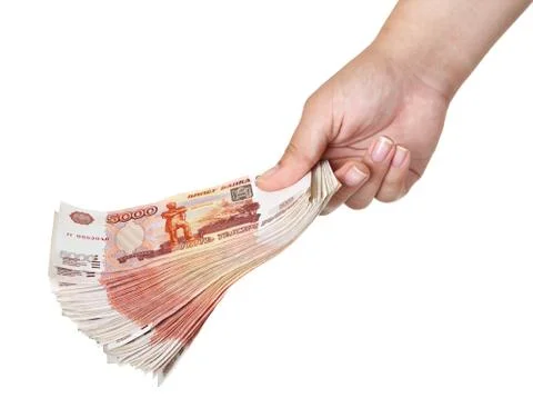 Stack of five thousandth bills in the female hand. Stock Photos