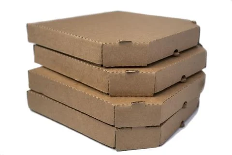 Stack flat brown cardboard pizza boxes isolated on a white background Stock Photos
