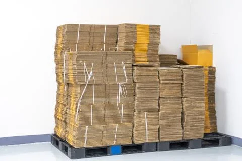 Stack of flat pack cardboard boxes for product packaging and delivery. Stock Photos