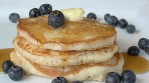 A stack of fluffy breakfast American pancakes with fresh blueberries. Stock-Footage 336589318
