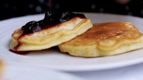 A stack of fluffy breakfast American pancakes with fresh blueberries. Stock-Footage 336589327