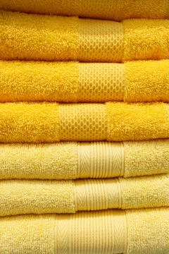 A stack of fluffy colored towels in close-up Stock Photos