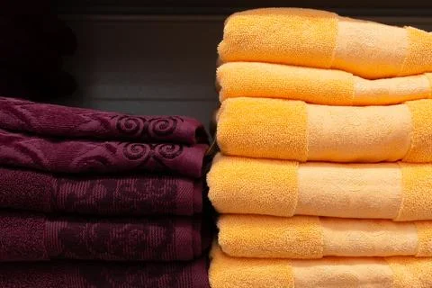 A stack of fluffy colored towels in close-up Stock Photos