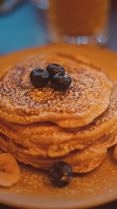 Stack of Fluffy Pancakes with Blueberries on White Plate Stock Footage 334603171