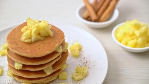 Stack of fluffy pancakes with butter and syrup on a white plate Stock Photos
