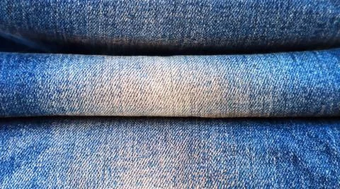 Stack of folded blue jeans close-up Foto stock