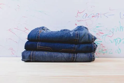 A stack of folded blue jeans Foto stock