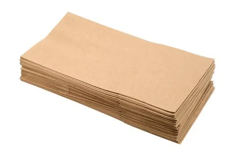 Stack of folded brown craft paper napkins isolated on white background. Cle.. Stock Photos