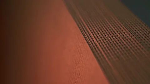 A stack of folded carton boxes is illuminated in red. Stock Footage 142623400