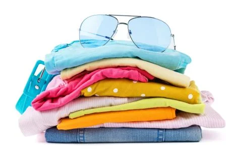 Stack of folded clothes on white background. Stock Photos