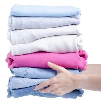 Stack folded clothing in female hand Stock Photos