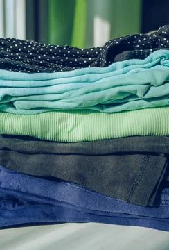 Stack of folded colorful woman's tops Stock Photos