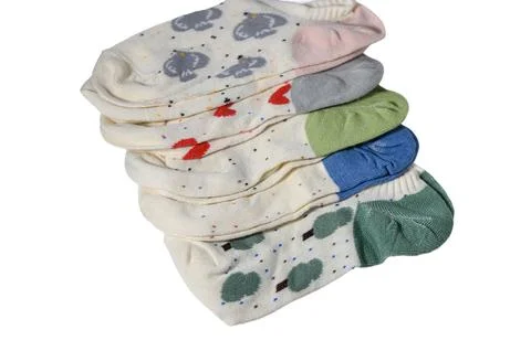 Stack of folded cute patterned ankle socks with various designs Stock Photos