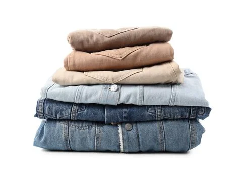 Stack of folded denim and khaki jackets, casual clothing for men and women, i Foto stock