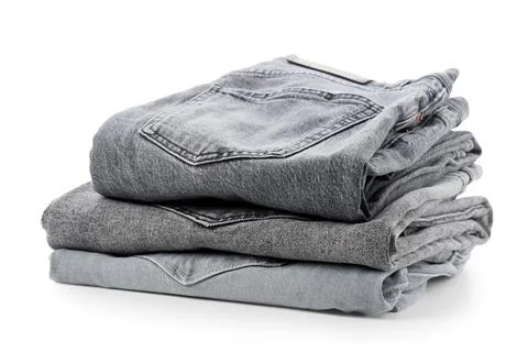 Stack of folded gray denim jeans, casual fashion apparel and clothing retail  Fotos de archivo