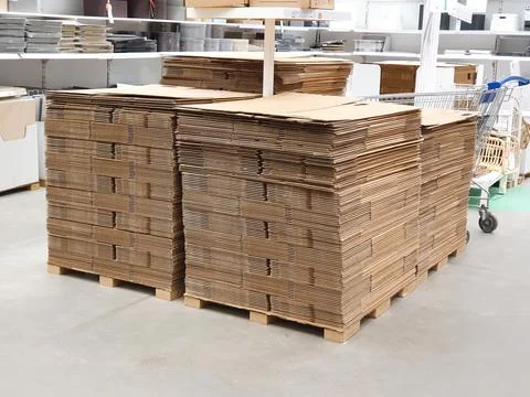 Stack of folded paper box in warehouse or hardware store Stock Photos