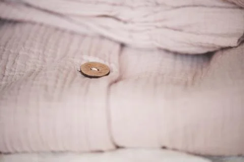 Stack of folded textile in room. Spring female clothes. Fashionable. Stock-Fotos