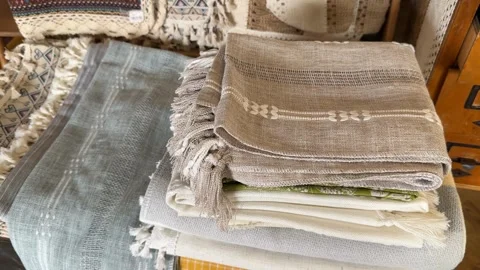 Stack of folded textiles with various patterns and textures, perfect for a .. Stock Footage 341420699