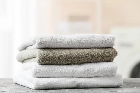 Stack of folded towels on a surface Stock Photos