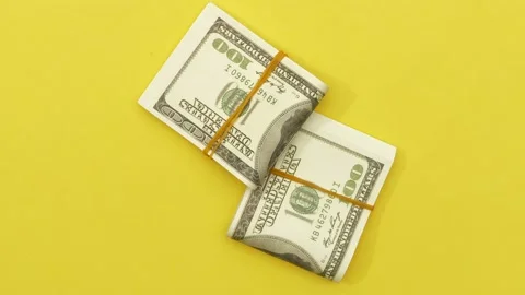 Stack of folded US currency notes Stock Footage 138632111