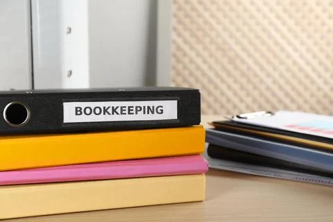 Stack of folders on desk in office, space for text. Bookkeeper's workplace Foto stock