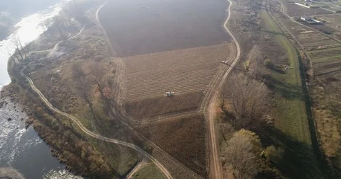 Stack of footage: Aerial view of combine harvester working. 4k Stockbeeldmateriaal 116489773
