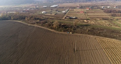 Stack of footage: Aerial view of tractor carries the harvest. 4k 動画素材 116491160