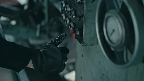 STACK OF FOOTAGE: Dirty gloved hand of a worker presses the red button Stock Footage 149825832