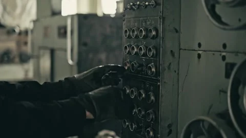 STACK OF FOOTAGE: Gloved hand of a worker presses buttons on the control panel 스톡 동영상 149825690