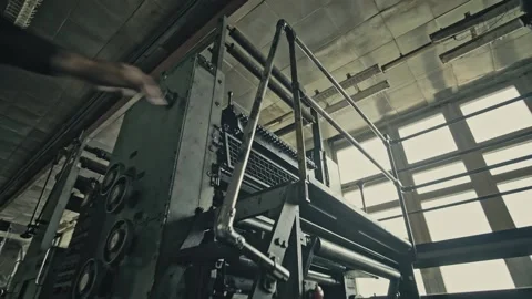 Stack of footage: A man climbs the stairs in an Old printing house of production Stock Footage 149826897